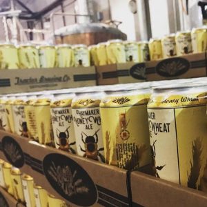 Cases of Haymaker Honey Wheat cans