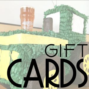 Gift Cards with tractor pinata and a pint in the background