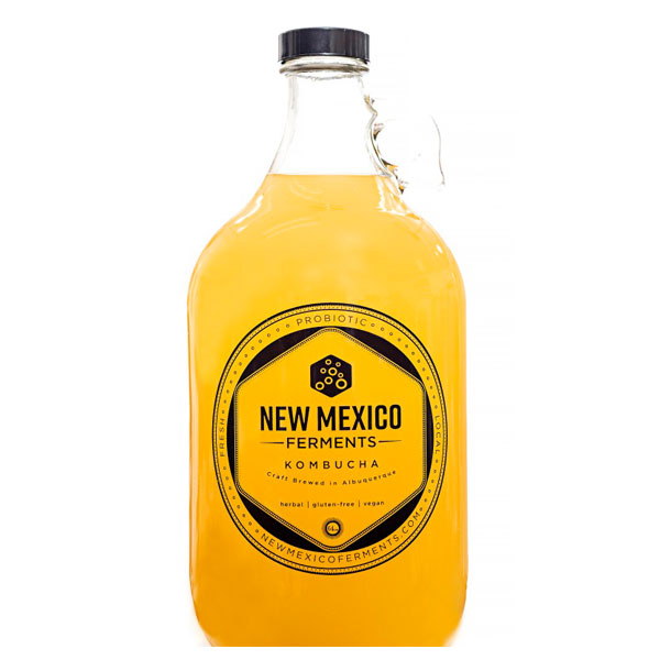 New Mexico Ferments Kombucha Clear Glass Growler with yellow liquid